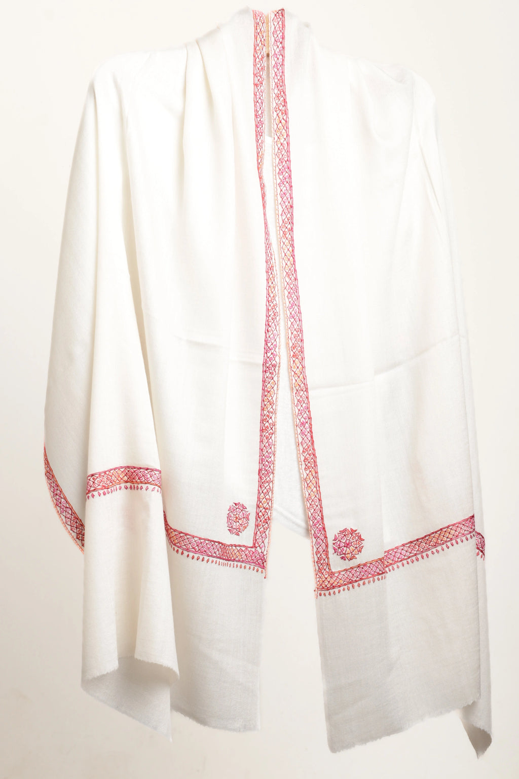 White garment with red embroidery on a white background