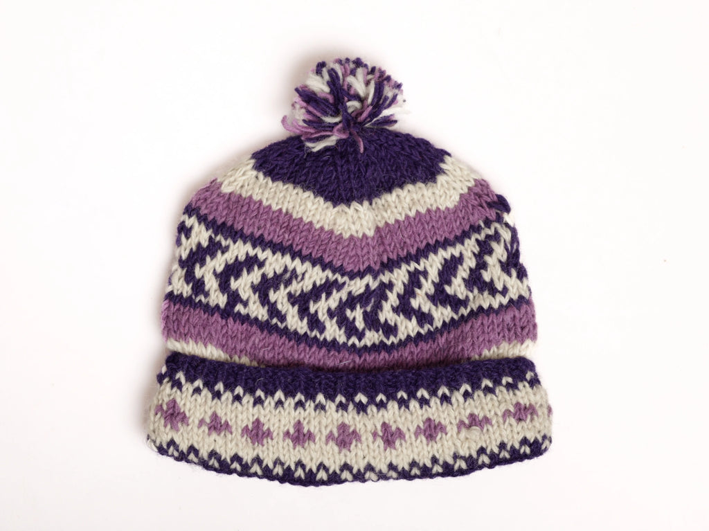 Knitted hat with purple and white pattern on a white background