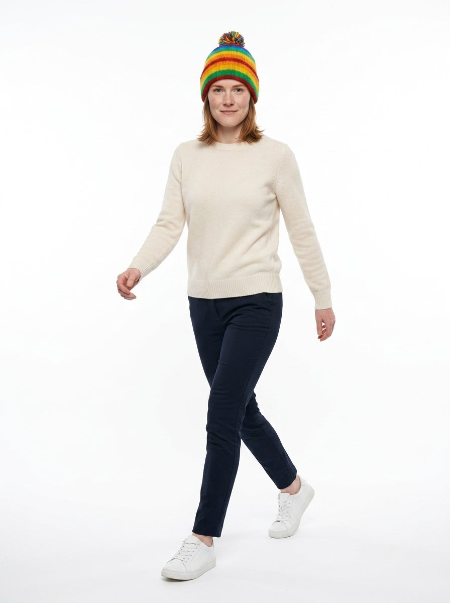 Knit pom-pom beanie — On Model - Walking | Generated by Modelize