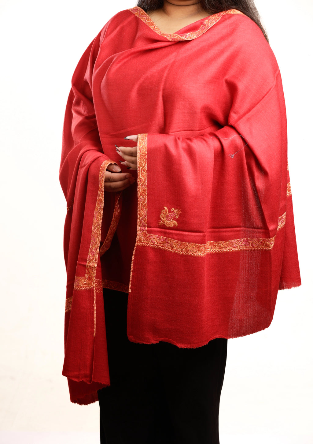 Red shawl with gold embroidery on a white background